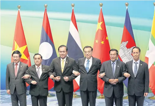  ??  ?? VISION: Thai PM Prayut Chan-o-cha, third left, next to China Premier Li Keqiang, right, among LMC leaders from Vietnam, Laos, Cambodia and Myanmar.