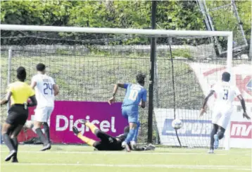  ?? (Photo: Dwayne Richards) ?? Molynes United striker Nicholas Nelson (second right) watches his effort beat Mount Pleasant goalkeeper David Swaby (on the ground) in the Premier League match at The UWI-JFF Captain Horace Burrell Centre of Excellence on Sunday. (From left) Looking on are referee Odette Hamilton and Mount Pleasant defenders Osani Ricketts and Ladale Richie.