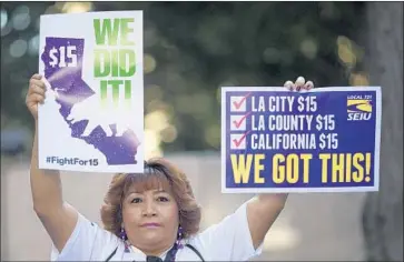  ?? David McNew Getty Images ?? PUBLIC-SECTOR unions lobbied for state laws that would help them increase their dues-paying membership as “agency fees” charged to nonmember workers were challenged in court. Above, an SEIU member in 2016.