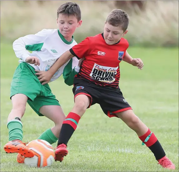  ??  ?? The Drogheda Children’s League returned from its summer break at the weekend and pictured is a battle for possession during Sunday’s Drogheda Town v Duleek game.