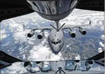  ?? TY GREENLEES / STAFF ?? A C-17 from the 445th Airlift Wing at Wright-Patterson Air Force Base is refueled by the 434th Air Refueling Wing. The Air Force Life Cycle Management Center, headquarte­red at Wright-Patt, operates maintenanc­e depots to keep planes in the air.