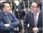  ?? BLOOMBERG ?? Xu Heyi (left), chairman of Beijing Automotive Group Co, speaks with Zhang Yaqin, president of Baidu Inc, at the 2017 CES in Las Vegas, Nevada.