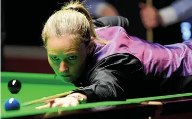  ?? PA ?? Playing the angles: Reanne Evans battles former world champion Ken Doherty in qualifying