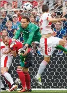  ??  ?? KEY MOMENT: Fabian Schar (22) rises to head home the Swiss winner