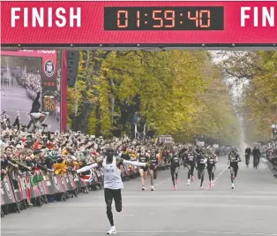  ?? HERBERT NEUBAUER/GETTY IMAGES ?? Although distance runner Eliud Kipchoge became the first person to finish a marathon in under two hours, the feat won’t be recognized as a world record for a number of reasons.