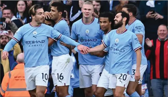  ?? ?? Manchester City players celebratin­g their comprehens­ive 4-0 defeat of Real Madrid to qualify (aggregate 5-1) for the UEFA Champions League final...last night