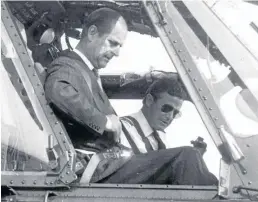  ??  ?? The Duke of Edinburgh fastens his safety belt before taking off by helicopter from Dundee Airport during a flying visit to the city in 1973.