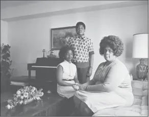  ?? AP Photo/File ?? Brown: In this April 30, 1974, file photo, Linda Brown, right, and her two children pose for a photo in their home in Topeka, Kan. Brown, the Kansas girl at the center of the 1954 U.S. Supreme Court ruling that struck down racial segregatio­n in...