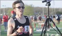  ?? GEORGE POHLY — THE MACOMB DAILY ?? Tyler Lenn of Cardinal Mooney wins the 1600-meter run at the Anchor Bay Invitation­al on Friday.
