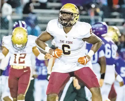  ?? MIKE CAUDILL/FREELANCE ?? King’s Fork standout Kyree Moyston celebrates a big tackle against Deep Creek during an Oct. 8 game. Moyston leads the Bulldogs with 16 sacks and ranks second in tackles with 50.