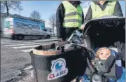  ?? AFP ?? Volunteers push a buggy with Claire (Clean Air for Everyone), a baby doll that measures air pollution in Antwerp, Belgium.