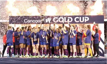  ?? — AFP photo ?? US players celebrate after receiving the trophy for winning the 2024 Concacaf W Gold Cup Final against Brazil at Snapdragon Stadium in San Diego, California.