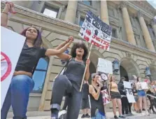  ?? DAVE SCHERBENCO/THE CITIZENS’ VOICE VIA AP ?? Black Lives Matter supporters rally on the steps of the Luzerne County Courthouse in Wilkes-Barre, Pa., on June 7.