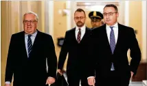  ?? ERIN SCHAFF / NEW YORK TIMES ?? Lt. Col. Alexander Vindman (right) arrives at the Capitol in Washington on Thursday to review the transcript of his closed-door interview with House impeachmen­t investigat­ors.