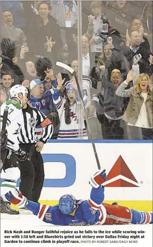  ?? PHOTO BY ROBERT SABO/DAILY NEWS ?? Rick Nash and Ranger faithful rejoice as he falls to the ice while scoring winner with 1:58 left and Blueshirts grind out victory over Dallas Friday night at Garden to continue climb in playoff race.