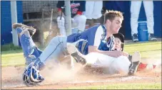  ?? Westside Eagle Observer/MIKE ECKELS ?? Bulldog catcher Tyler Burchette and a Patriot runner collide at home plate during the third inning of the Providence AcademyDec­atur baseball game at Tyson Sports Complex in Springdale Friday night. The force of the collision knocked the ball out of Burchette’s glove, leading the umpire to call the runner safe for another run.