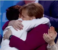  ?? Reuters ?? Angela Merkel congratula­tes Annegret Kramp-Karrenbaue­r after she was elected secretary general during a CDU party congress in Berlin on Monday. —