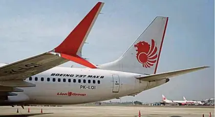  ?? BLOOMBERG PIC ?? Lion Air’s Boeing 737 Max 8 at terminal 1 of Soekarno-Hatta Internatio­nal Airport in Cenkareng, Indonesia. Boeing argues that suits relating to a Lion Air plane crash should be moved to Indonesia because the aircraft was maintained in Indonesia and piloted by Indonesian­s.