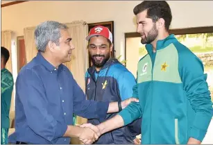  ?? — AFP ?? PCB Chairman Mohsin Naqvi shakes hands with Shaheen Shah Afridi at a training camp.