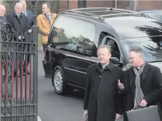  ?? MARTIN McKEOWN ?? Archbishop Eamon Martin (left), Primate of all Ireland, at the funeral of his mother, Catherine Martin, at St Patrick’s Church in Derry