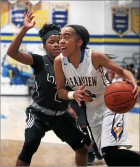  ?? RANDY MEYERS — THE MORNING JOURNAL ?? Brandyce Smith of Clearview drives the baseline around Ashley Hisle of Lorain. Smith scored her 1,000th career point on Feb. 3 against Buckeye.