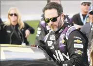  ?? John Raoux / Associated Press ?? Seven-time NASCAR champion Jimmie Johnson has tested positive for the coronaviru­s and will miss this weekend’s race at Indianapol­is Motor Speedway.