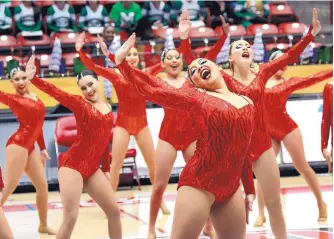  ??  ?? In red, Roswell moved up a classifica­tion this season and finished barely behind Atrisco Heritage in the large school division.