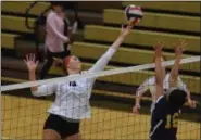  ?? AUSTIN HERTZOG - DIGITAL FIRST MEDIA ?? Boyertown’s Emily Wolfe (19) tips the ball over the net against Pope John Paul II.