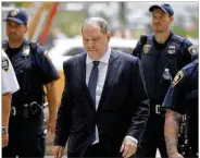  ?? SETH WENIG / ASSOCIATED PRESS ?? Harvey Weinstein arrives to court in New York before Thursday’s developmen­ts. The Manhattan District Attorney’s office dropped part of the case against the former movie mogul.