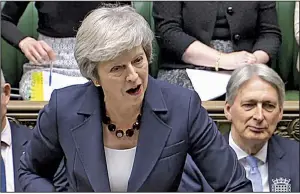  ?? AP ?? British Prime Minister Theresa May speaks Wednesday in the House of Commons. May warned opponents to support the plan “or leave with no deal, or no Brexit at all.”