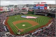  ?? MARK TENALLY — THE ASSOCIATED PRESS FILE ?? The Washington Nationals Park in Washington, D.C. Profession­al sports teams and gambling companies in the U.S. are increasing­ly bringing the sports book to the game, opening sports betting facilities in or near stadiums.