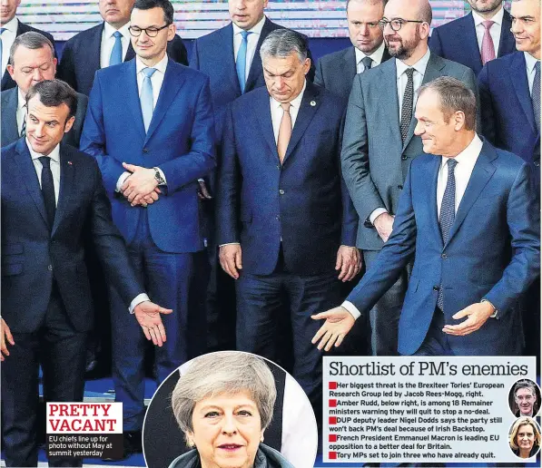  ??  ?? EU chiefs line up for photo without May at summit yesterday