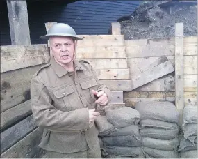  ?? KENT SPENCER/PNG ?? Jim Millar, executive director of the Port Moody Station Museum, stands in trench network dug by 50 volunteers as part of a commemorat­ive exhibit.