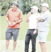  ?? ?? GINEBRA coach Tim Cone (right) shares a light moment with Vince Hizon (left) and Fausto Preysler during the second day of the 35th Mango Tee at the Alabang Country Club on Tuesday.