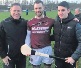  ??  ?? Great day: Man of the match Neil McManus (centre) with John DeNovi (left) after Cushendall’s Antrim final win over Loughgiel on Sunday