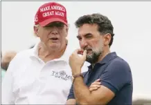  ?? Photo credit ?? Former President Donald Trump talks with Yasir Al-Rumayyan, governor of Saudi Arabia’s Public Investment Fund during the Bedminster Invitation­al LIV Golf tournament in Bedminster, NJ., July 29.