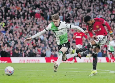  ?? | EPA ?? AMAD Diallo, right, of Manchester United, scored the fourth goal in the Red Devils’ 4-3 victory over Liverpool on Sunday.