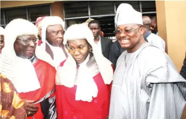  ??  ?? Governor Abiola Ajimobi (right), flanked by the Chief Judge of Oyo State, Hon. Justice Munta Ladipo Abimbola (left), and Hon. Justice Misturah Oladeinde (middle), at the 2015/2016 Legal Year Service held at the Central Mosque, Oja’ba Ibadan