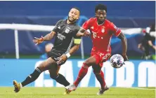  ?? FRANCK FIFE/REUTERS ?? Bayern Munich’s Alphonso Davies, right, tracks the ball in Champions League semifinal action against Olympique Lyonnais on Wednesday. Bayern won 3-0 to advance to the final.