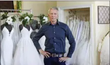  ?? TERESA CRAWFORD — THE ASSOCIATED PRESS ?? David Gaffke, owner of the bridal salon Complete Bridal, poses in his shop in East Dundee, Illinois, on Feb. 28, 2020.