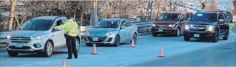  ?? ALLAN BENNER
THE ST. CATHARINES STANDARD ?? Niagara Regional Police officers run a RIDE spot-check in this file photo. The holiday RIDE campaign is underway and will continue into the new year.