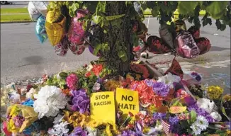  ?? Kent Nishimura Los Angeles Times ?? A MEMORIAL across the street from the site of Saturday’s mass shooting in Buffalo, N.Y.