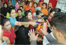  ??  ?? The garment workers shout as they protest for higher wages in Dhaka. — Reuters