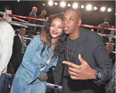  ?? JERRITT CLARK/WIREIMAGE ?? Rihanna and Jay Z attend the 2015 Throne Boxing Fight Night at The Theater at Madison Square Garden.