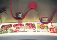  ??  ?? Packs of different KitKat flavours are seen at a ‘Chocolator­y’ boutique shop in Tokyo.