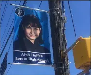  ?? KEVIN MARTIN — THE MORNING JOURNAL ?? A banner honoring Lorain High School graduate Alysa Hoffee hangs on East 28th Street at Grove Avenue in Lorain.