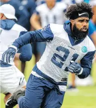  ?? GUS RUELAS / THE ASSOCIATED PRESS ?? Dallas Cowboys star running back Ezekiel Elliott had an incident-free off-season and enters the new NFL campaign focused solely on football.