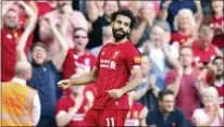  ?? ANTHONY DEVLIN — PA VIA AP ?? Liverpool’s Mohamed Salah celebrates scoring during the English Premier League match against Arsenal at Anfield on Sunday.