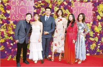  ?? Tribune News ?? From left, Ken Jeong, Constance Wu, Henry Golding, Gemma Chan, Awkwafina and Jing Lusi attending the Crazy Rich Asians Premiere held at Ham Yard Hotel, London, UK, on Sept. 4, 2018.