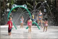  ?? ALLEN EYESTONE / THE PALM BEACH POST ?? School’s out and you’re looking for something for the kiddos? Make like Leo Pang, 2, (left) of Palm Beach Gardens, who played on June 7 at the newly renovated Splash Zone at Palm Beach Gardens Aquatic Complex. The Splash Playground, Spray Pad and Play...